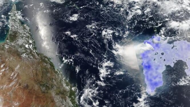 Satellite view of Earth showing Africa on the left and a purple-highlighted region off the eastern African coast in the Indian Ocean, with clouds visible overhead.
