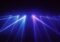 Laser light beams crisscross in blue and pink against a dark background, resembling a laser light show.