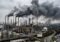 Industrial refinery with tall smokestacks emitting thick black smoke and orange flames, covering a wide facility with roads and vehicles nearby.